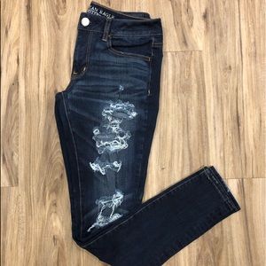 Distressed dark wash jeans